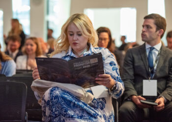 Woman reading FP Live! brochure