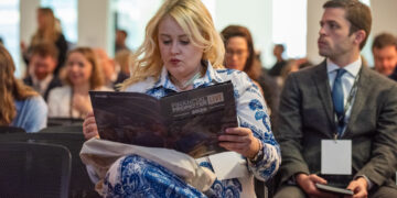 Woman reading FP Live! brochure