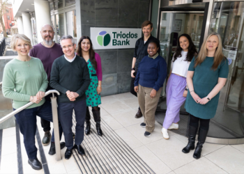 Triodos Bank's Zoe Ruthven (far left) and Mark Clayton (front left) celebrate the new identity with co-workers from across the bank