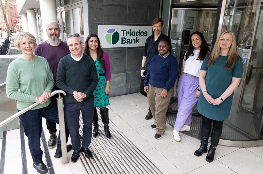 Triodos Bank's Zoe Ruthven (far left) and Mark Clayton (front left) celebrate the new identity with co-workers from across the bank