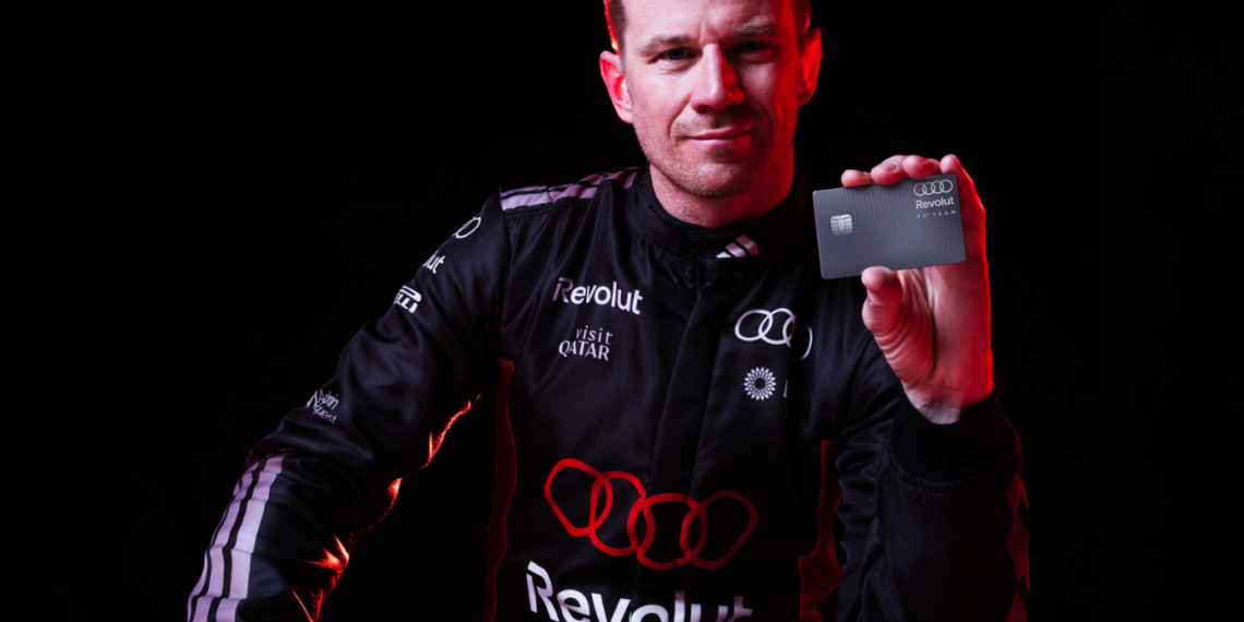 Niko Hulkenburg holding a silver Revolut card