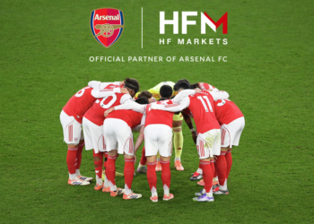 Arsenal players crowded in a team huddle