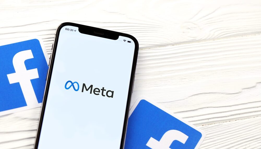 Phone showing Meta logo and facebook logos