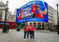 Up In Lights- the 17.6metre by 44.6metre screen. Pictured- Sophia Dunkley, Lauren Bell, Nat Sciver-Brunt. 'This Team, This Chance, This Moment, This Feels Different'.